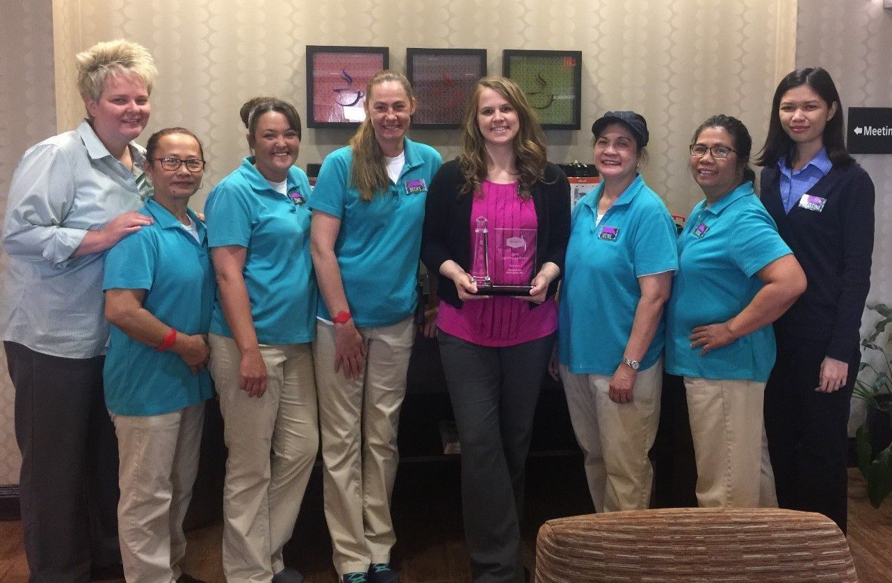 General Manager Cheyenne Wolf (center) and Hampton Inn Farmington team.jpg